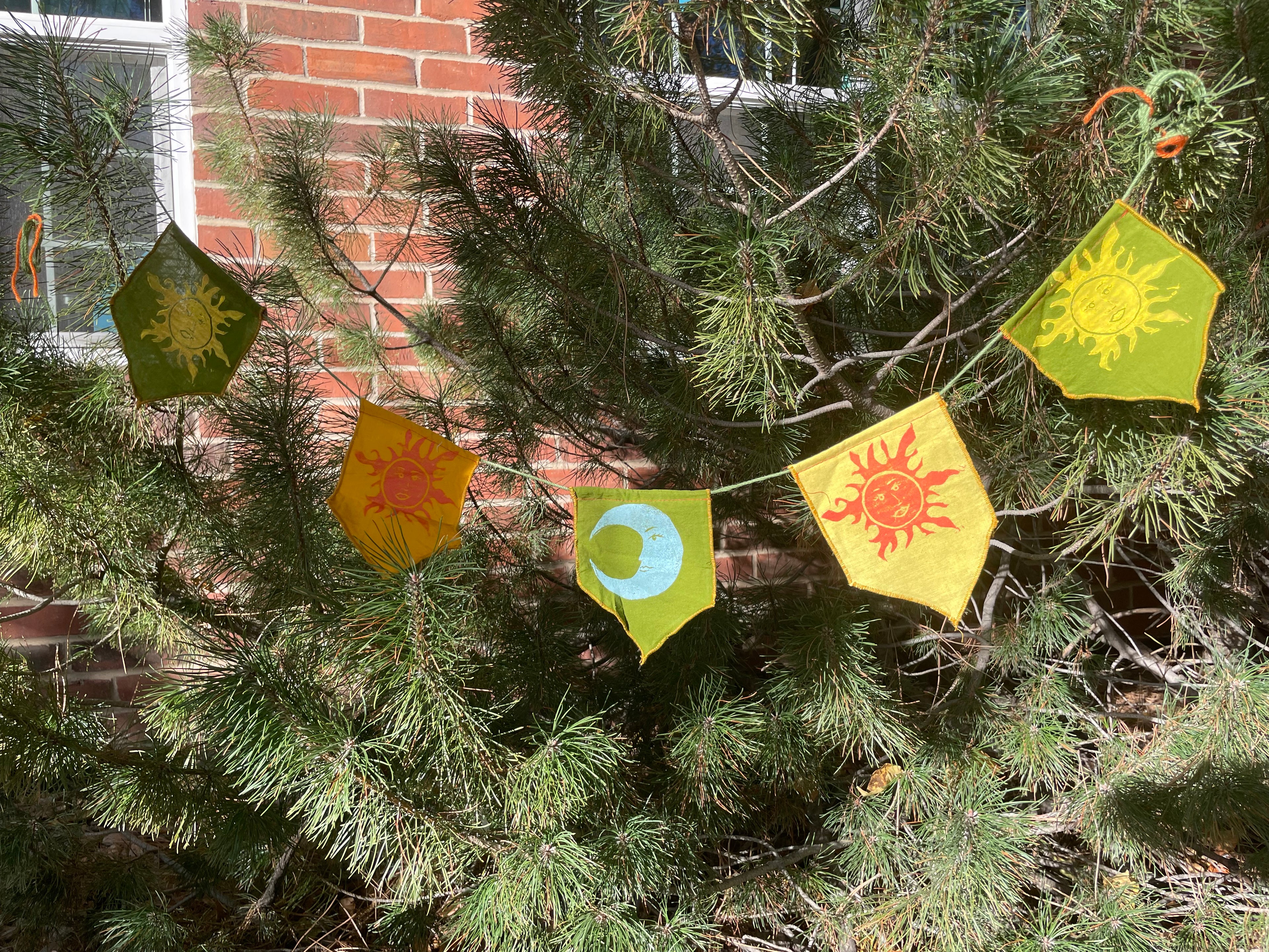5-flag whimsigoth sun and moon bunting garland, green, yellow, orange, and gold