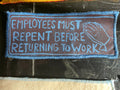 Textile patch with printed message on a dark surface