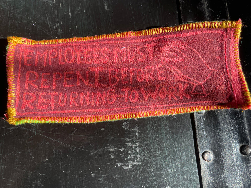 hot pink patch with dark red text on a dark background